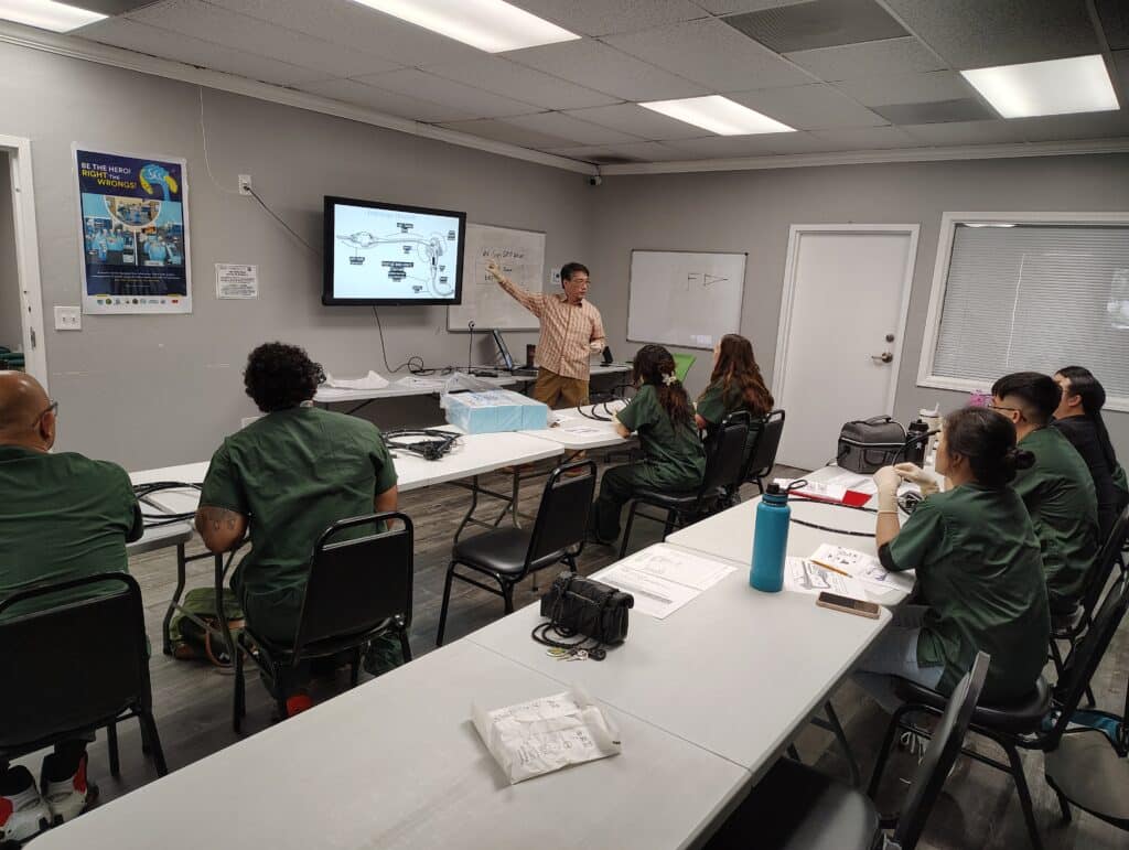 SPD Instructor teaching the class the anatomy of a flexible endocope.