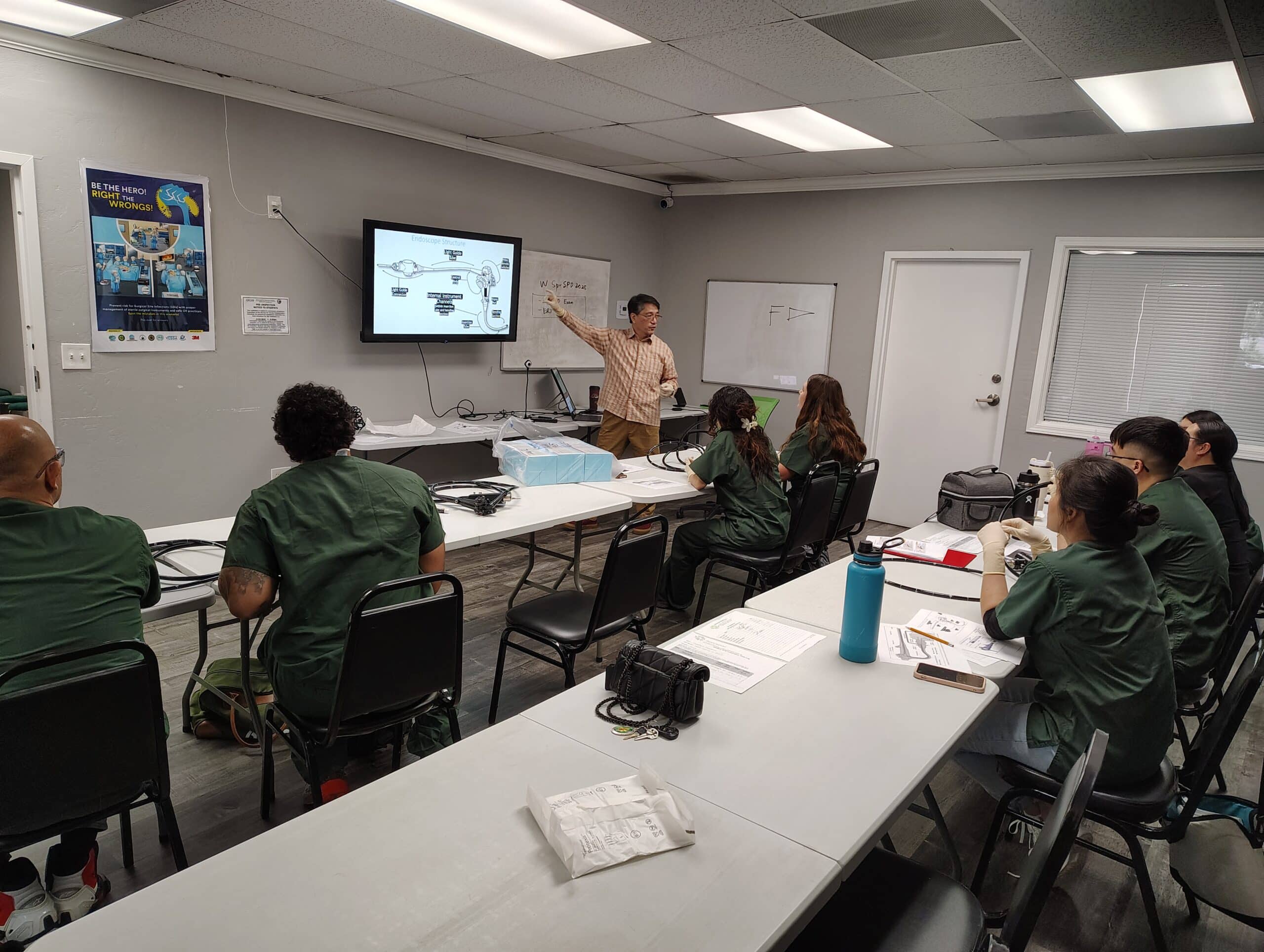 SPD Instructor teaching the class the anatomy of a flexible endocope.
